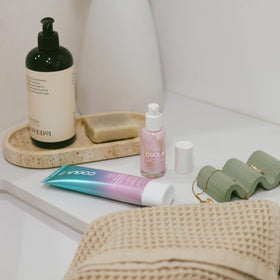 COOLA serum texture swiped on skin, illustrates lightweight hydrating finish