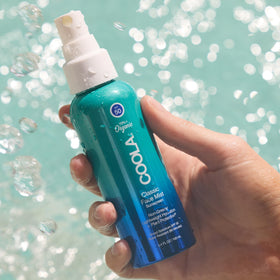 COOLA face mist ingredient label highlighting 70%+ certified organic ingredients benefit