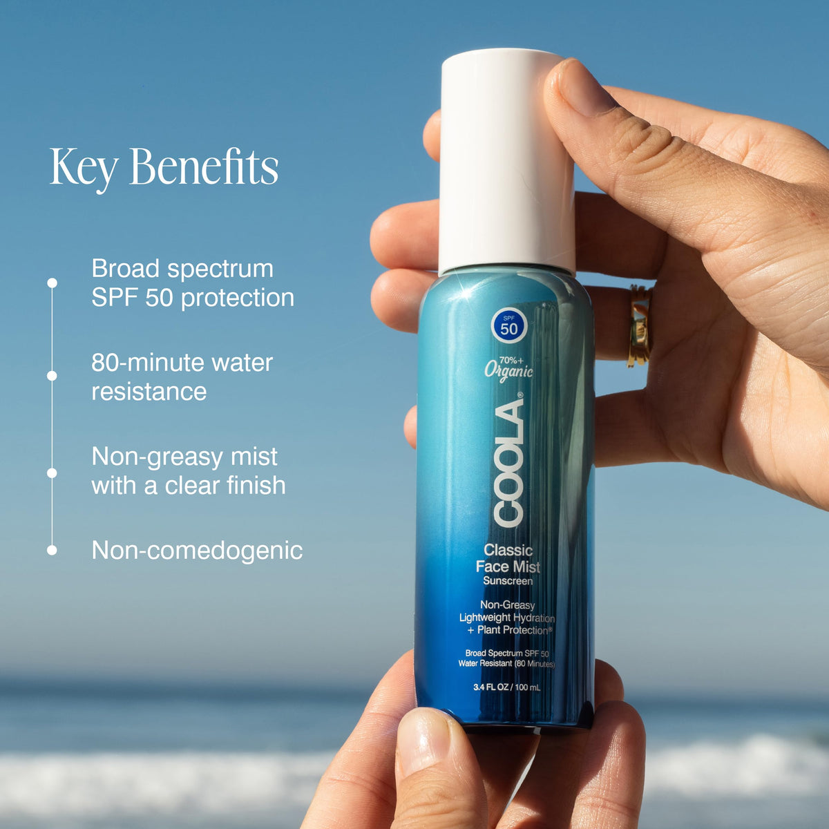 COOLA face mist spray closeup emitting fine mist for even, quick reapplication benefit