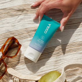 COOLA application on hands demonstrating non-greasy absorption