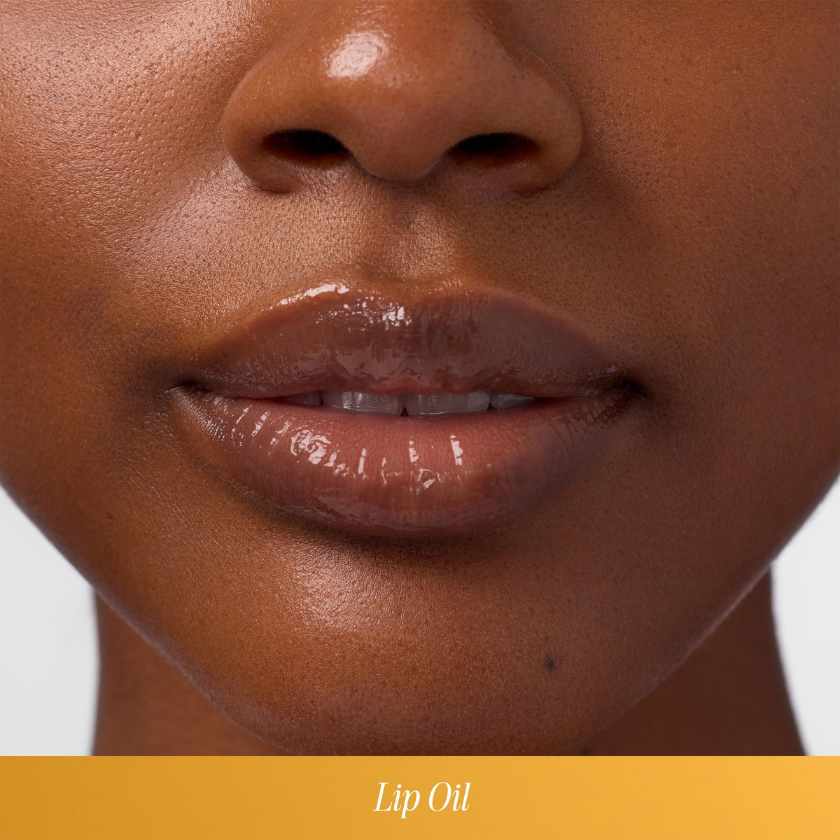 COOLA Liplux texture close-up on lips demonstrating hydration and shine benefit