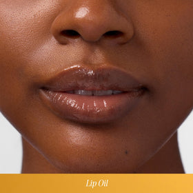 COOLA Liplux texture close-up on lips demonstrating hydration and shine benefit