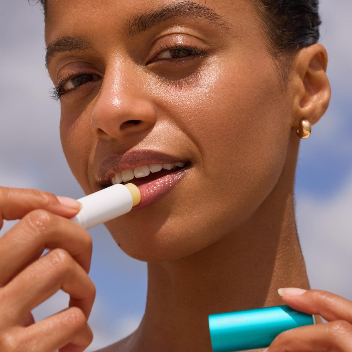COOLA Original Liplux SPF 30 stick open showing lip protection benefit