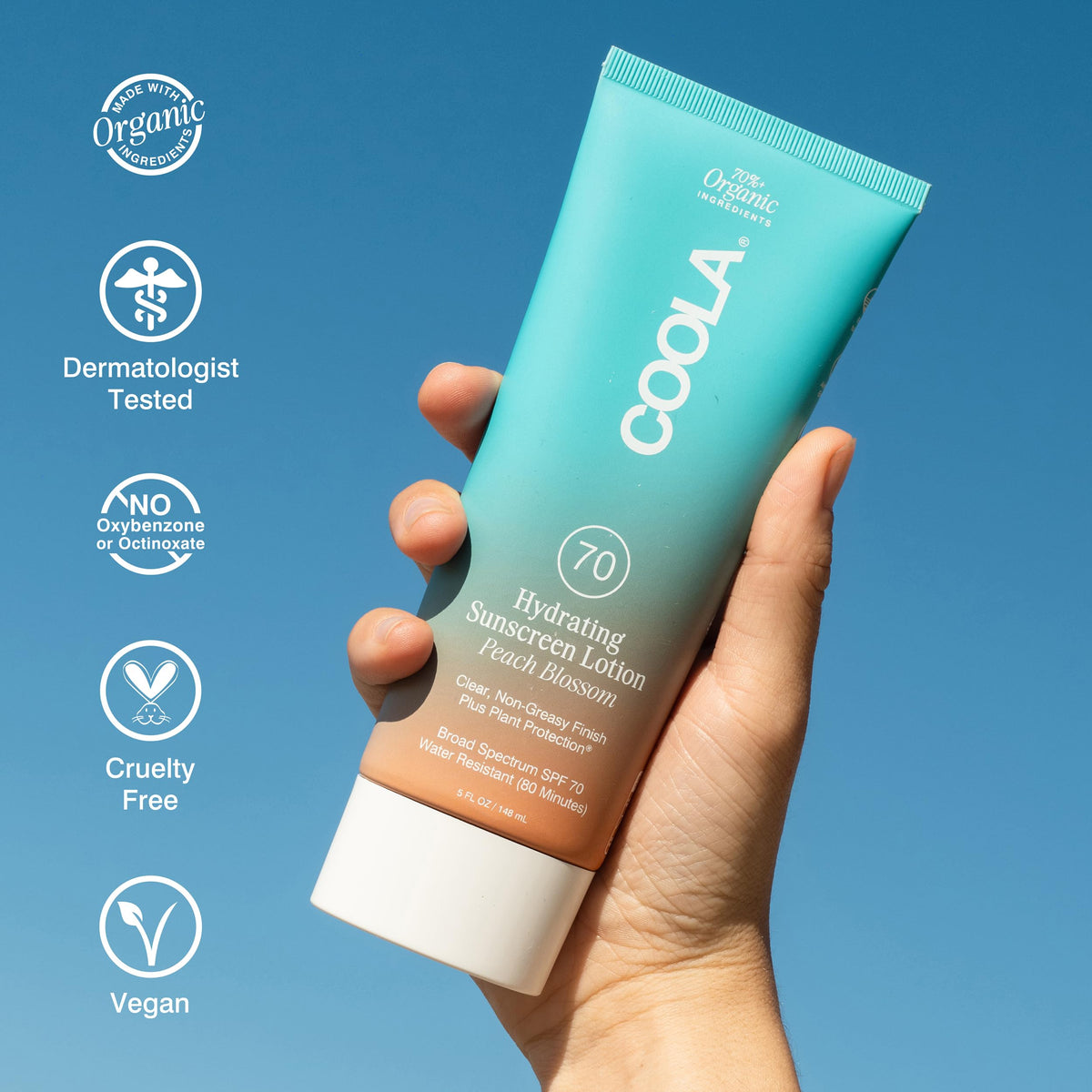 COOLA 5 fl oz size comparison next to hand showing portable travel-friendly benefit