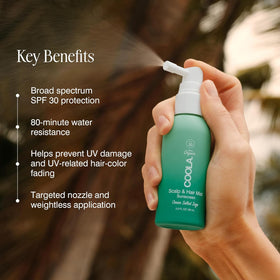 COOLA bottle in hand demonstrating compact 2oz travel-friendly size