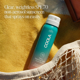 COOLA sheer mist texture on skin showing non‑greasy finish and quick absorption benefit