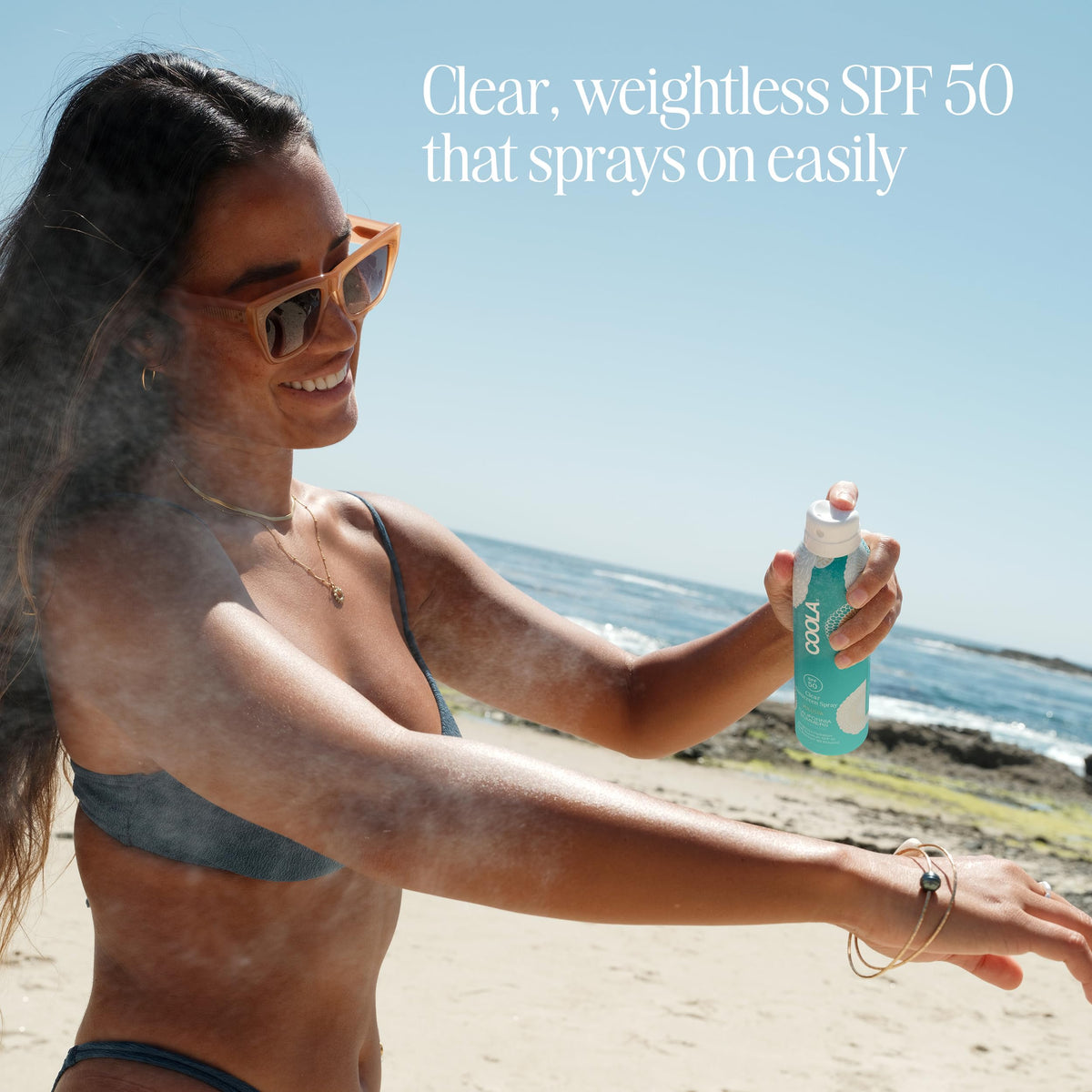 COOLA spray texture close-up demonstrating fast-absorbing feel
