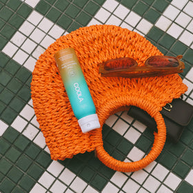 COOLA close-up of ultra-sheer texture absorbing into skin for non-greasy finish