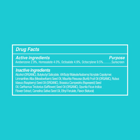 COOLA sprayed near water showing water-resistant formula for swimming benefit