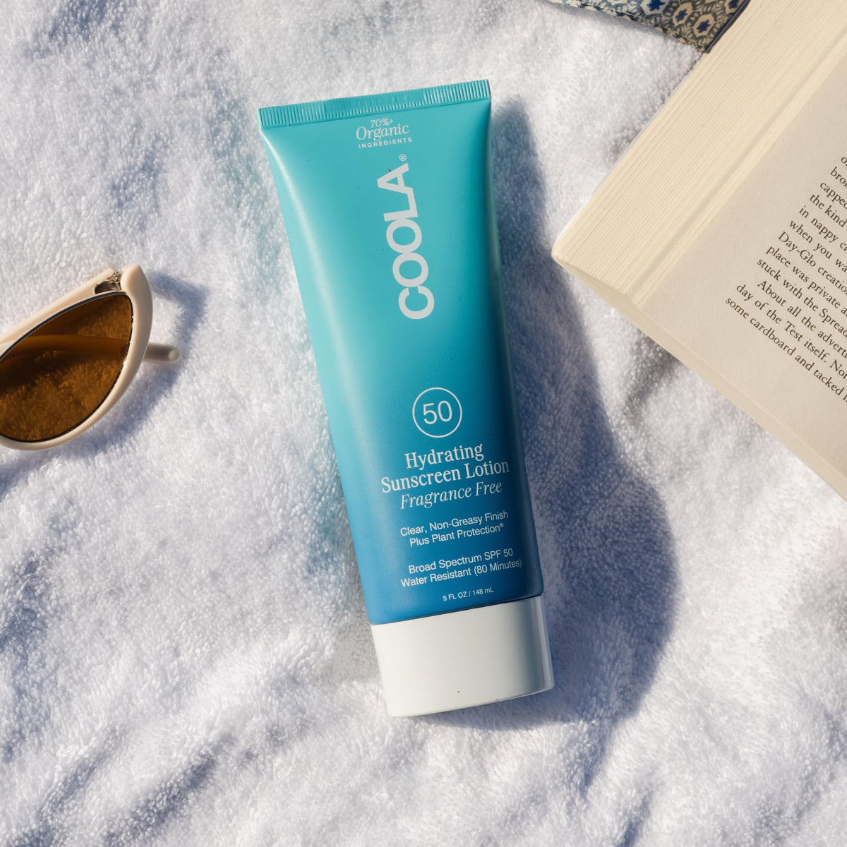 COOLA clear lotion texture demonstrating lightweight hydration