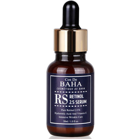 Cos De BAHA bottle on bedside table with lamp, showing lifestyle convenience