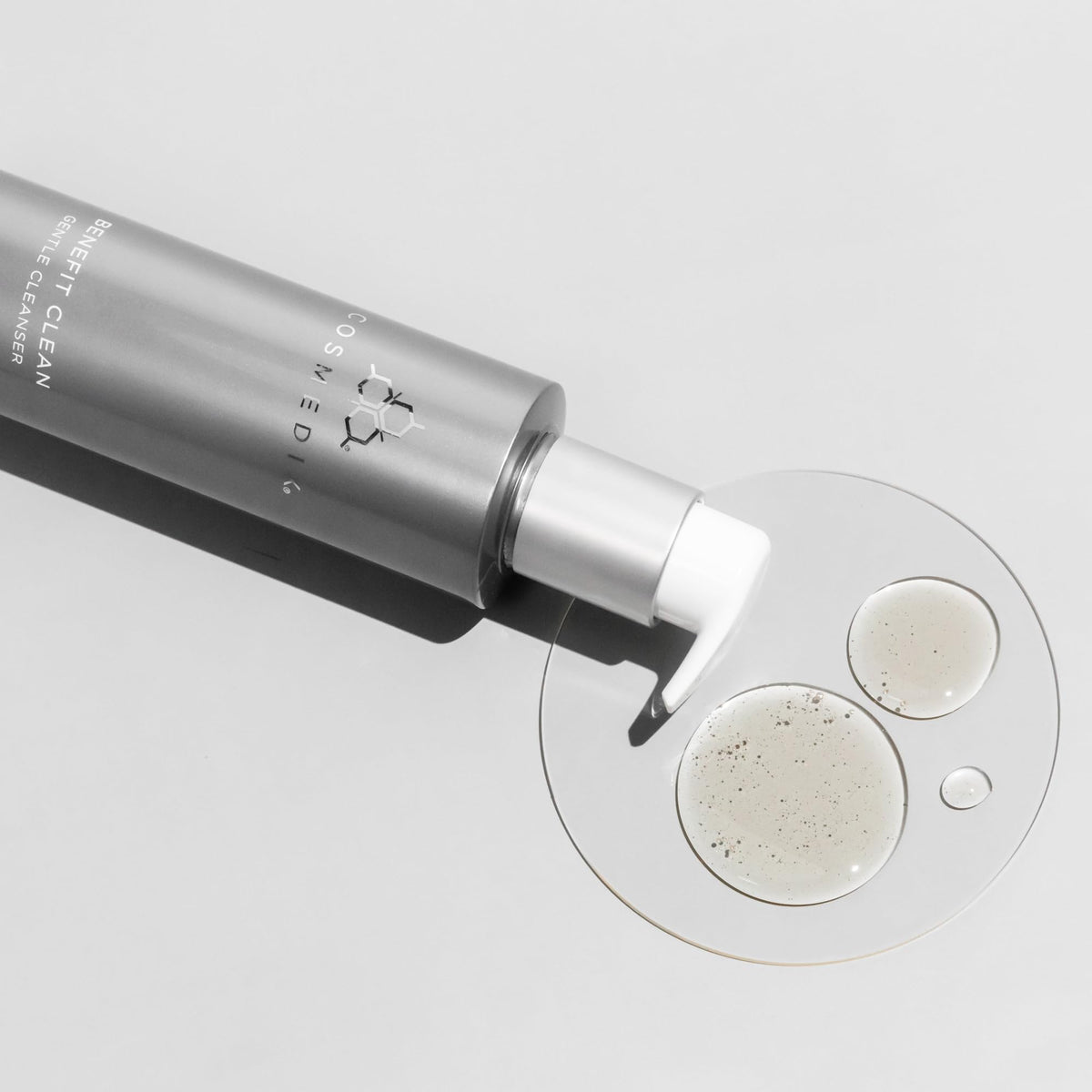 COSMEDIX 150ml bottle next to common items showing true scale