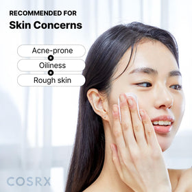 COSRX pad held in hand to show size and travel-friendly convenience