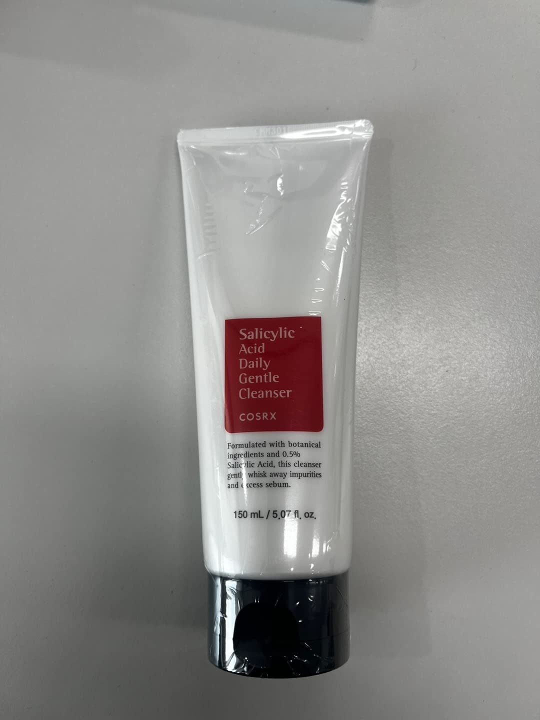COSRX label close-up highlighting salicylic acid and product purpose
