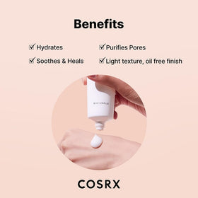 COSRX moisturizer in hand showing 80ml scale and travel-friendly size