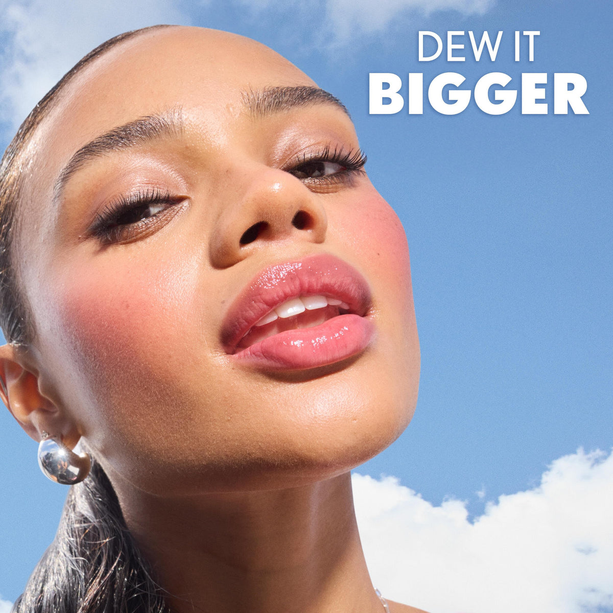 COVERGIRL layered over lipstick to show added glossy dimension