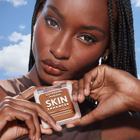 COVERGIRL brush applying powder to face for smooth finish