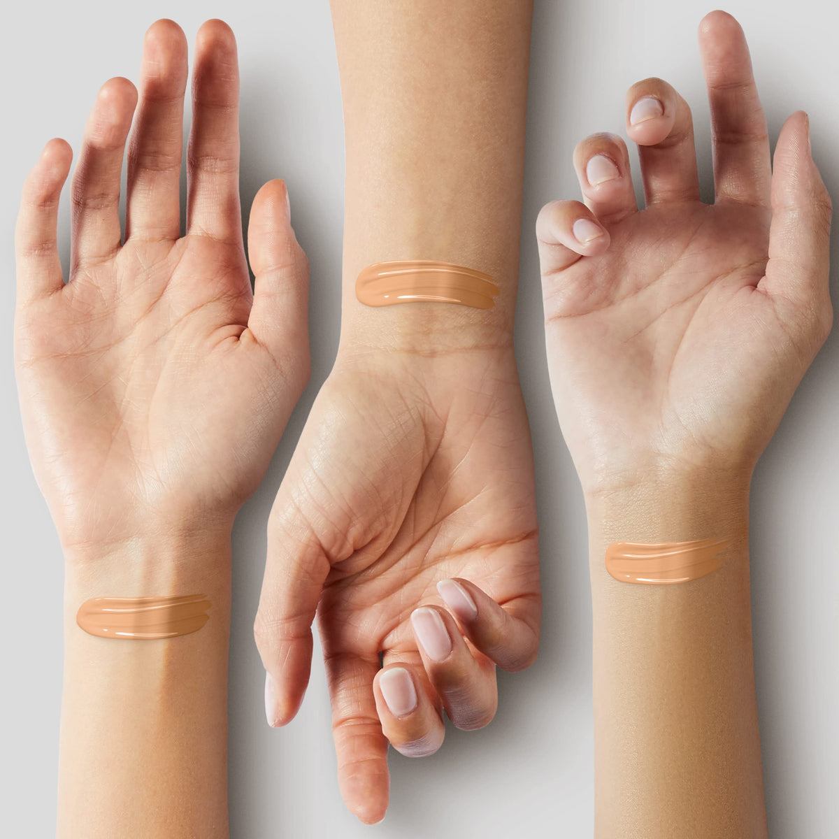 COVERGIRL blending foundation with a brush to show seamless finish and natural-looking coverage