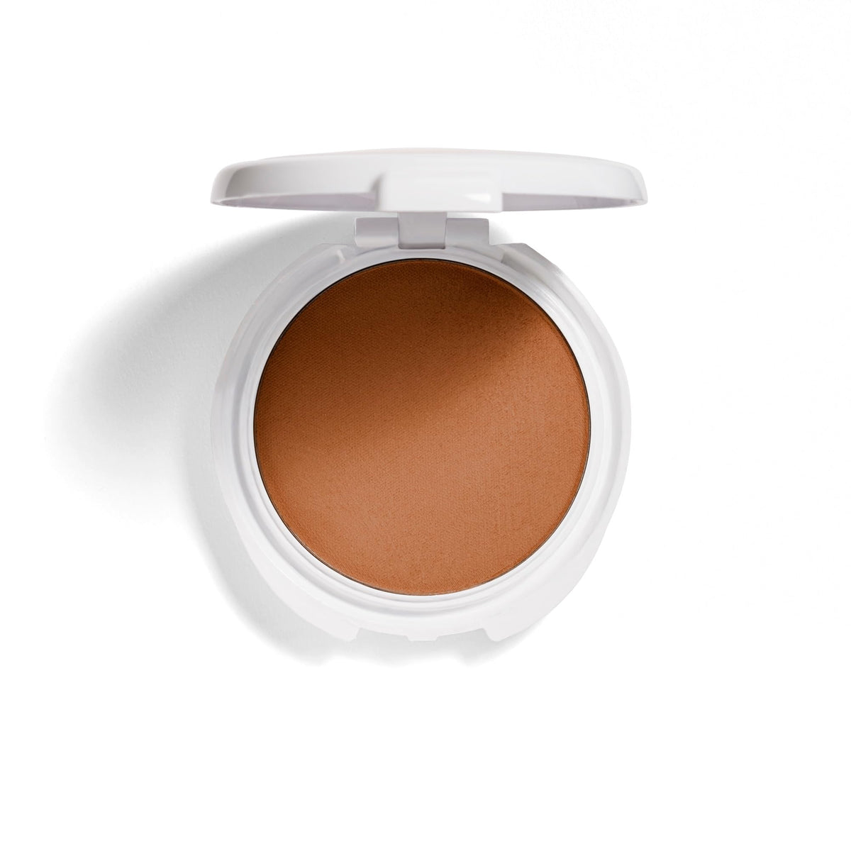 COVERGIRL open pan close-up revealing silky pressed powder texture and blendability
