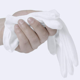 COYAHO gloves next to adult hand showing fit and length for most users