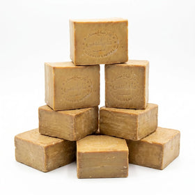 cozy soap texture close-up of olive-oil bar surface, highlights handcrafted quality