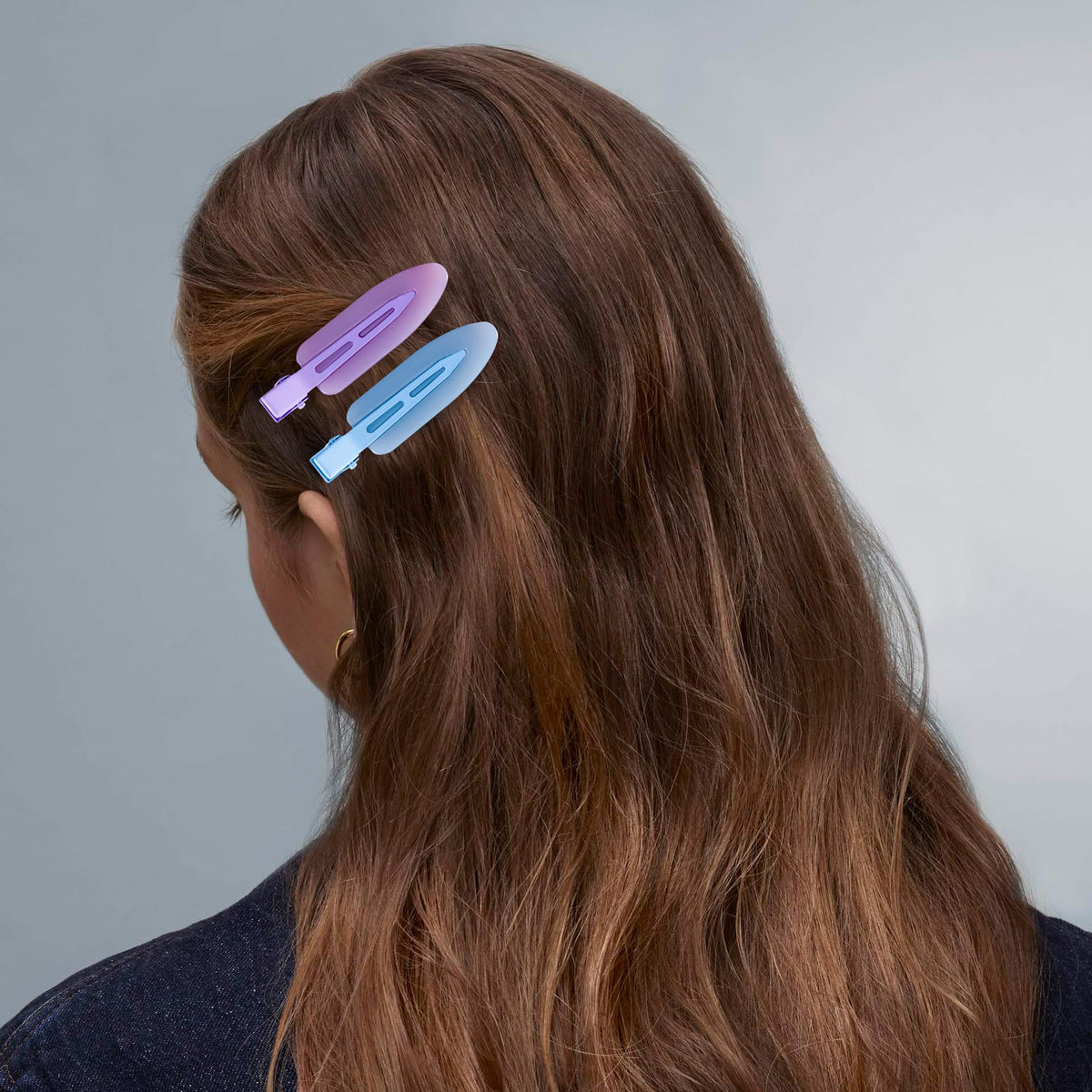 Cptots clip securing thick curly hair demonstrating strong gentle hold