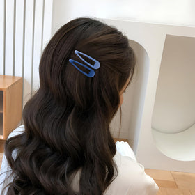 Cptots clip securing bangs offering discreet hold and polished look