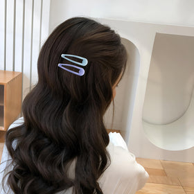 Cptots clip beside coin for scale, shows compact 1.97-inch size