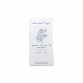 Crabtree & Evelyn boxed tube beside coin showing size and travel-friendly benefit