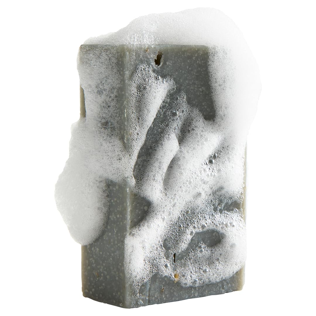 Crate 61 Organics bar producing wet lather on hand for effective gentle cleansing