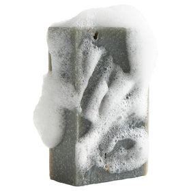 Crate 61 Organics bar producing wet lather on hand for effective gentle cleansing