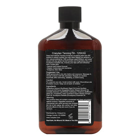 Crazytan bottle held in hand to show 8 oz scale and portable convenience