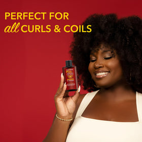 Creme of Nature oil pouring from dropper to show lightweight, non-greasy texture and shine