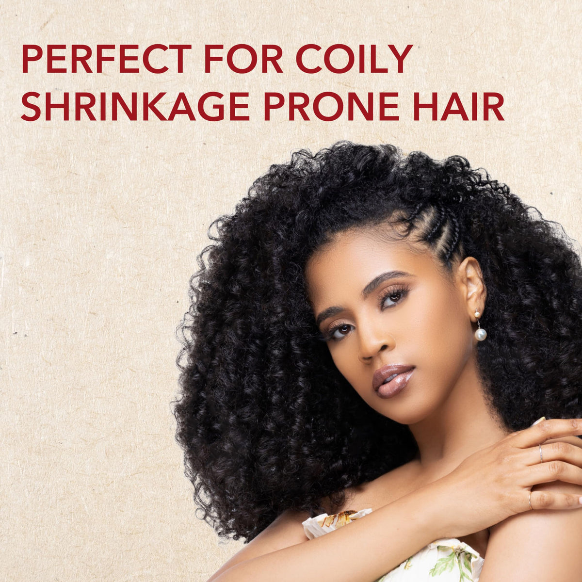 Creme of Nature styled twist-out on textured hair showing elongation and definition benefit