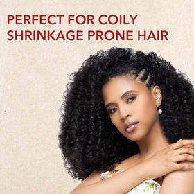 Creme of Nature styled twist-out on textured hair showing elongation and definition benefit