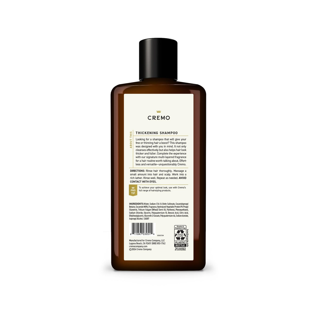 Cremo bottle held in hand showing 16 fl oz size and travel-friendly benefit