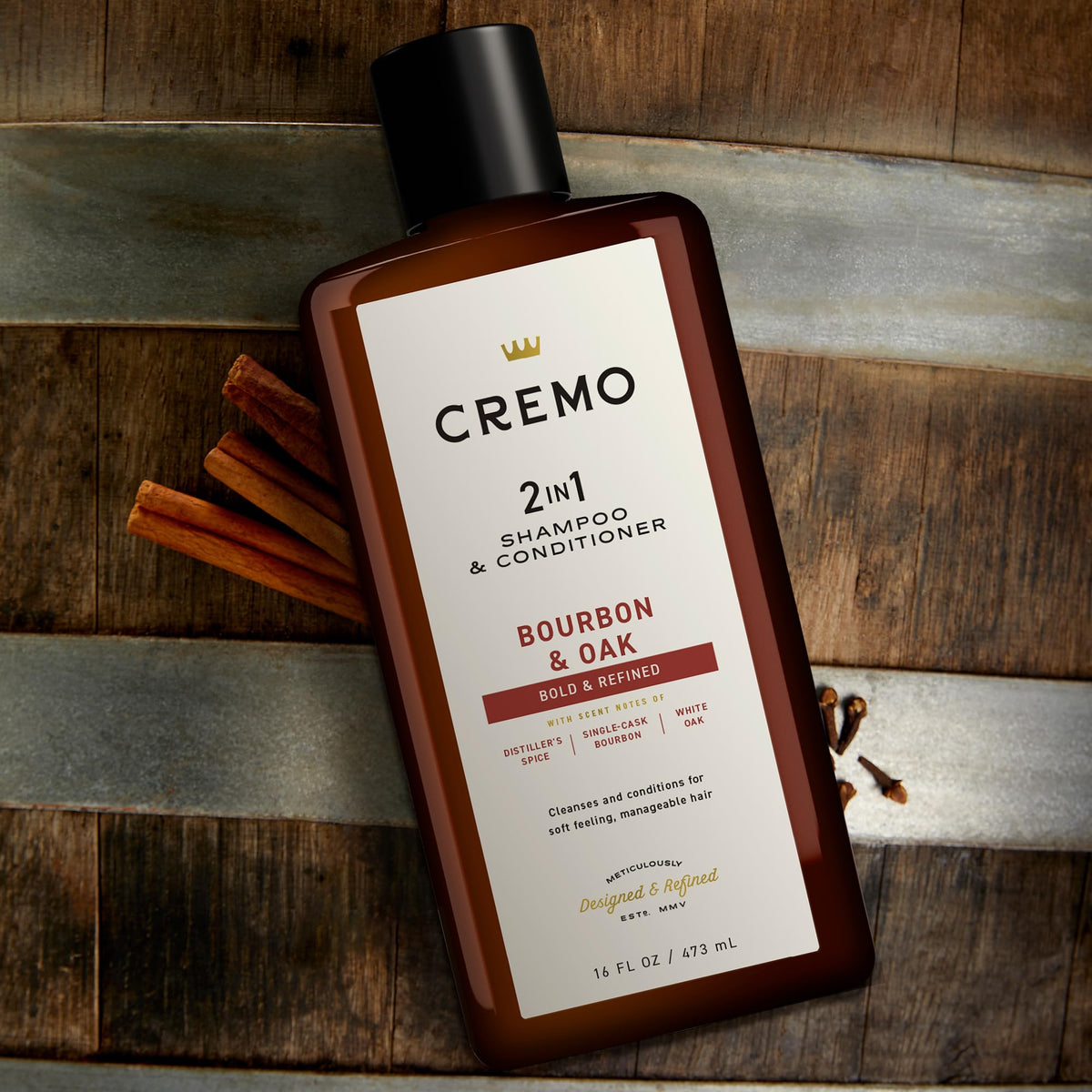 Cremo bottle in use under shower streams showing convenient everyday grooming benefit