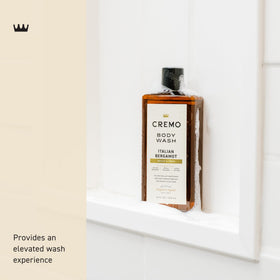 Cremo body wash texture on hand highlighting moisturizing creamy foam