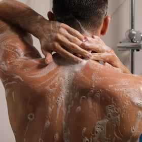 Cremo body wash in shower hand showing easy application and long-lasting scent benefit
