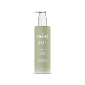Cremo bottle front label showing pear blossom scent and benefit of luxurious fragrance