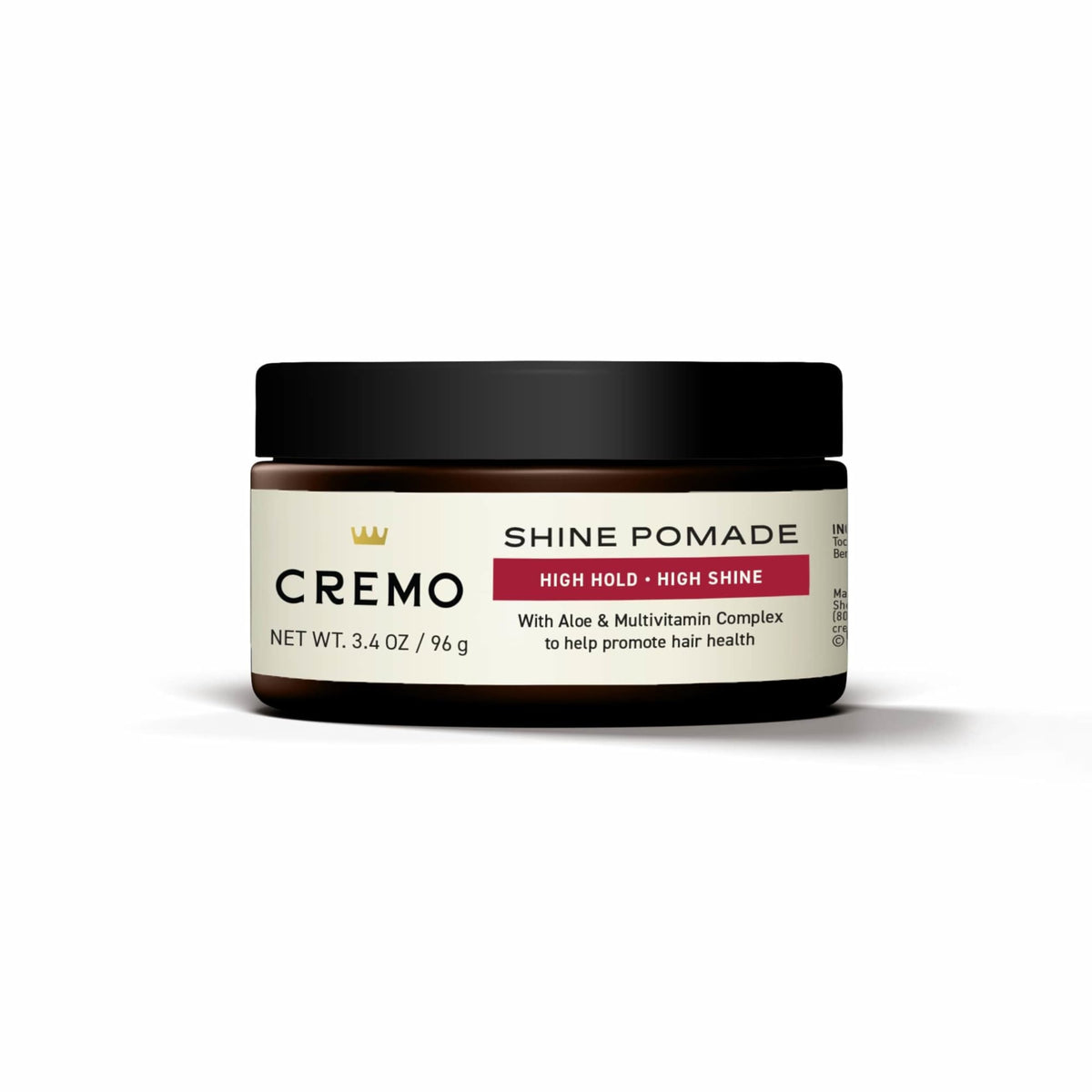 Cremo 3.4 oz jar next to ruler showing travel-friendly size benefit