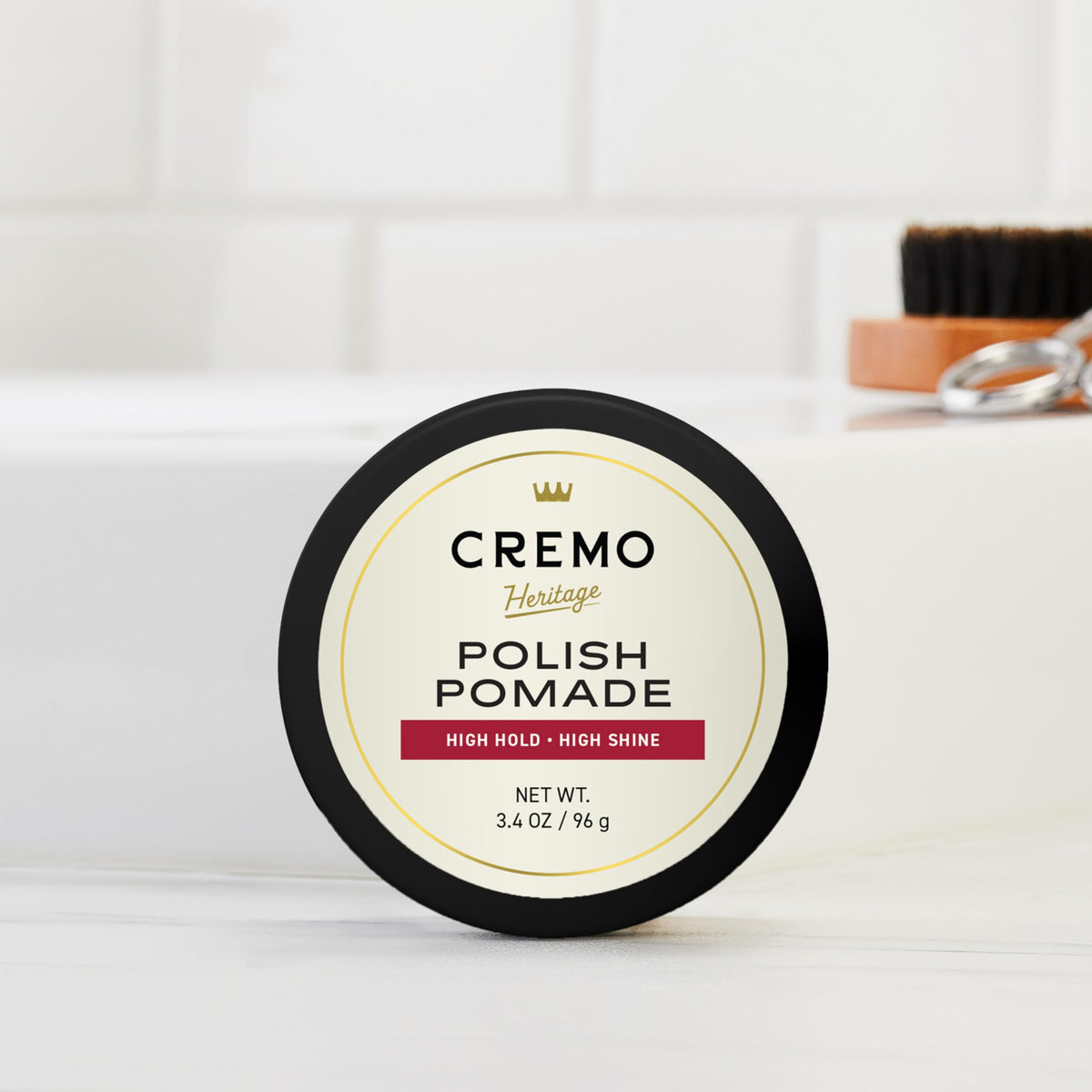 Finished slick-back hairstyle styled with Cremo for polished shine