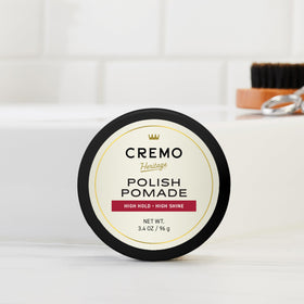 Finished slick-back hairstyle styled with Cremo for polished shine