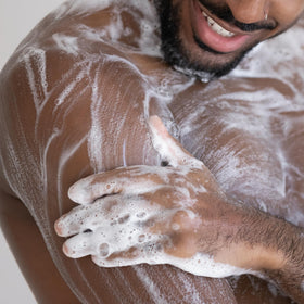 Cremo pouring into hand to show easy dispensing and lightweight moisturizing