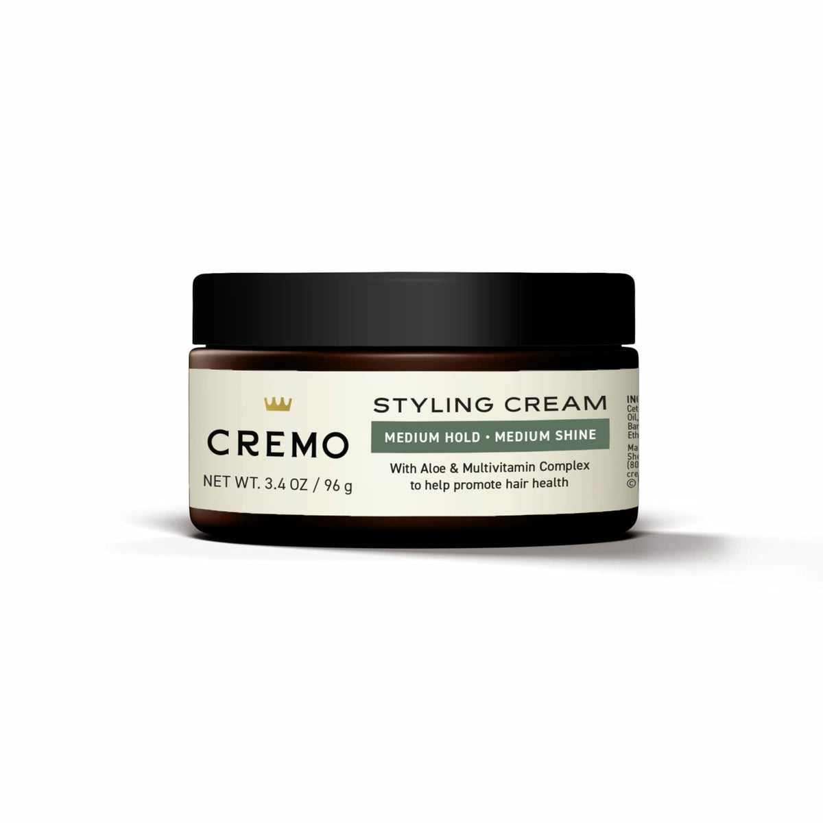 Cremo jar in hand demonstrating 3.4 oz size for travel convenience