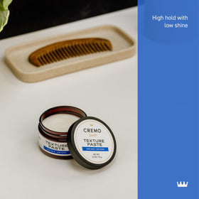 Cremo open jar revealing paste texture for easy scoop application