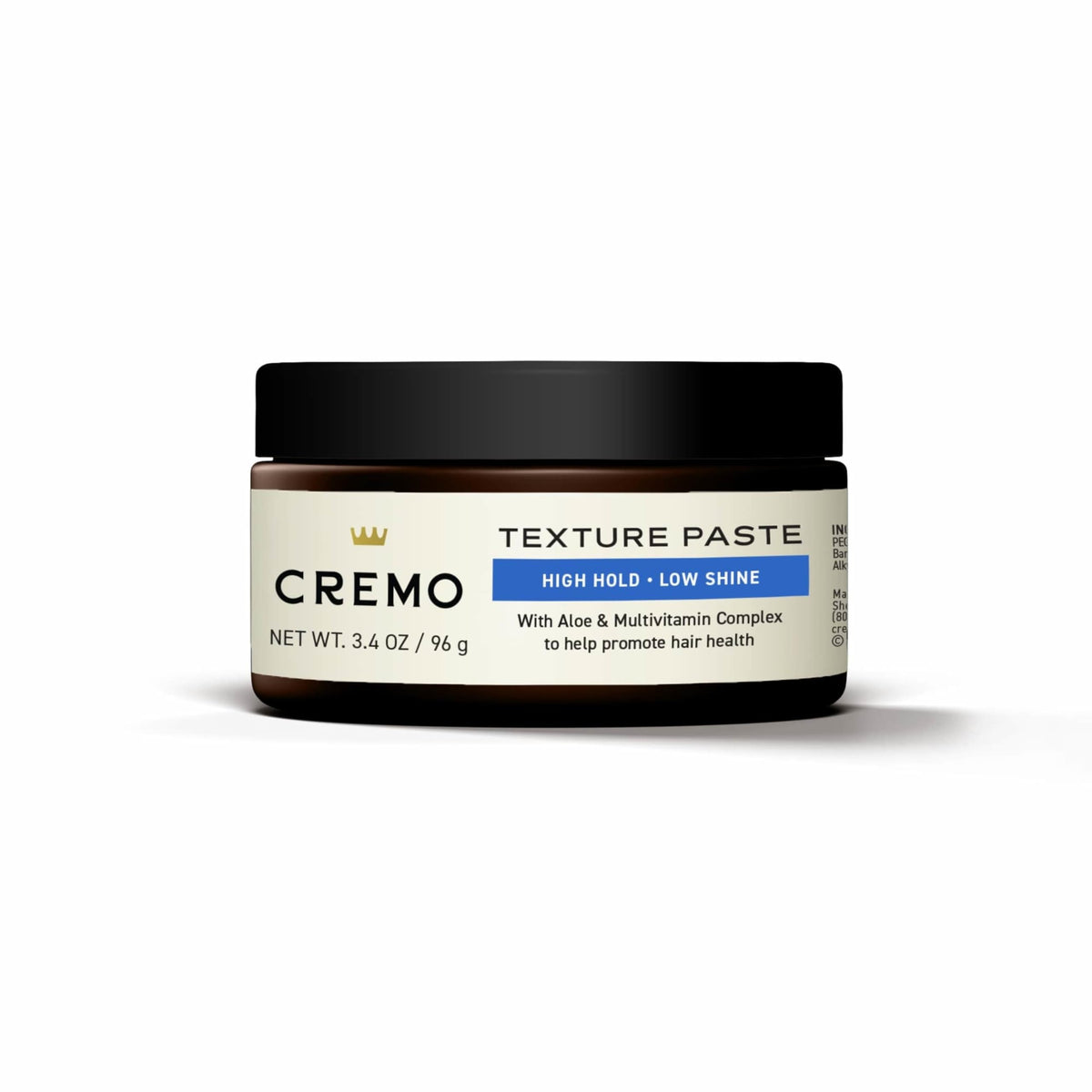 Cremo next to everyday objects showing 3.4 oz size for travel