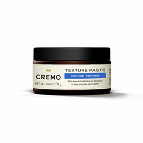 Cremo next to everyday objects showing 3.4 oz size for travel