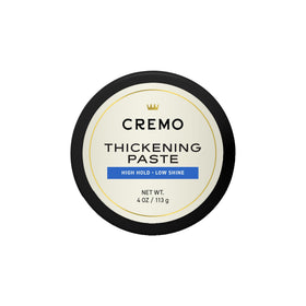 Cremo jar front view showing label and 4 oz size, highlights professional barber quality