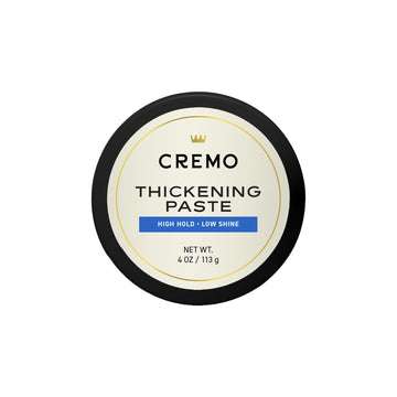 Cremo jar front view showing label and 4 oz size, highlights professional barber quality